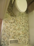 Pebble flooring in bathroom